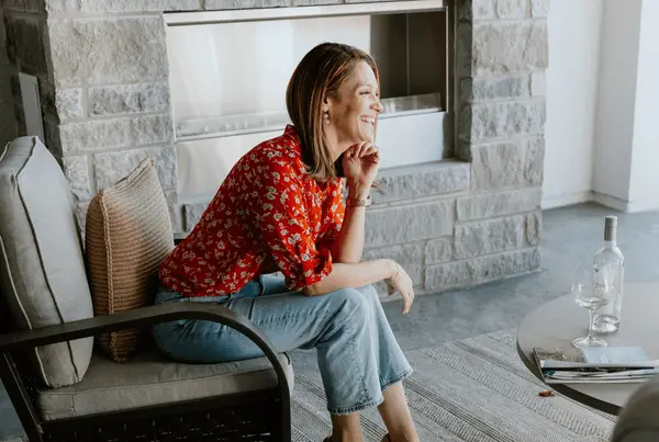 Kelly-Barta-Realtor-Sitting-On-Chair