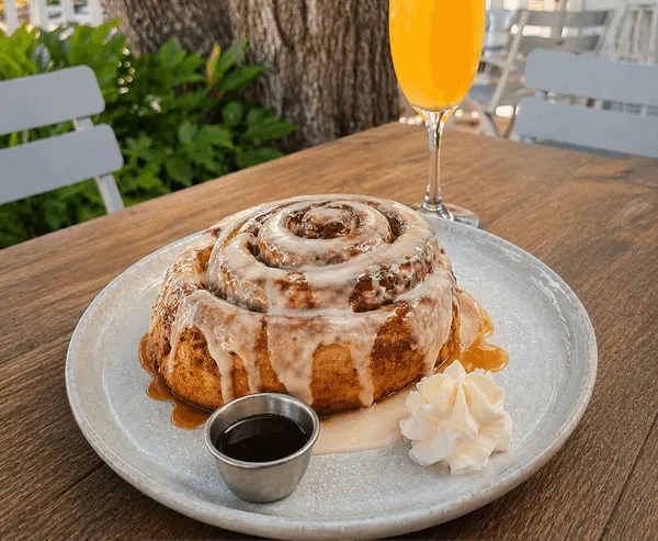 cinnamon roll with mimosa brunch
