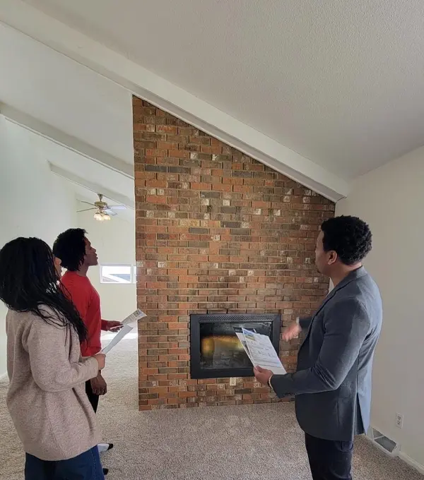 CJ with clients at open house