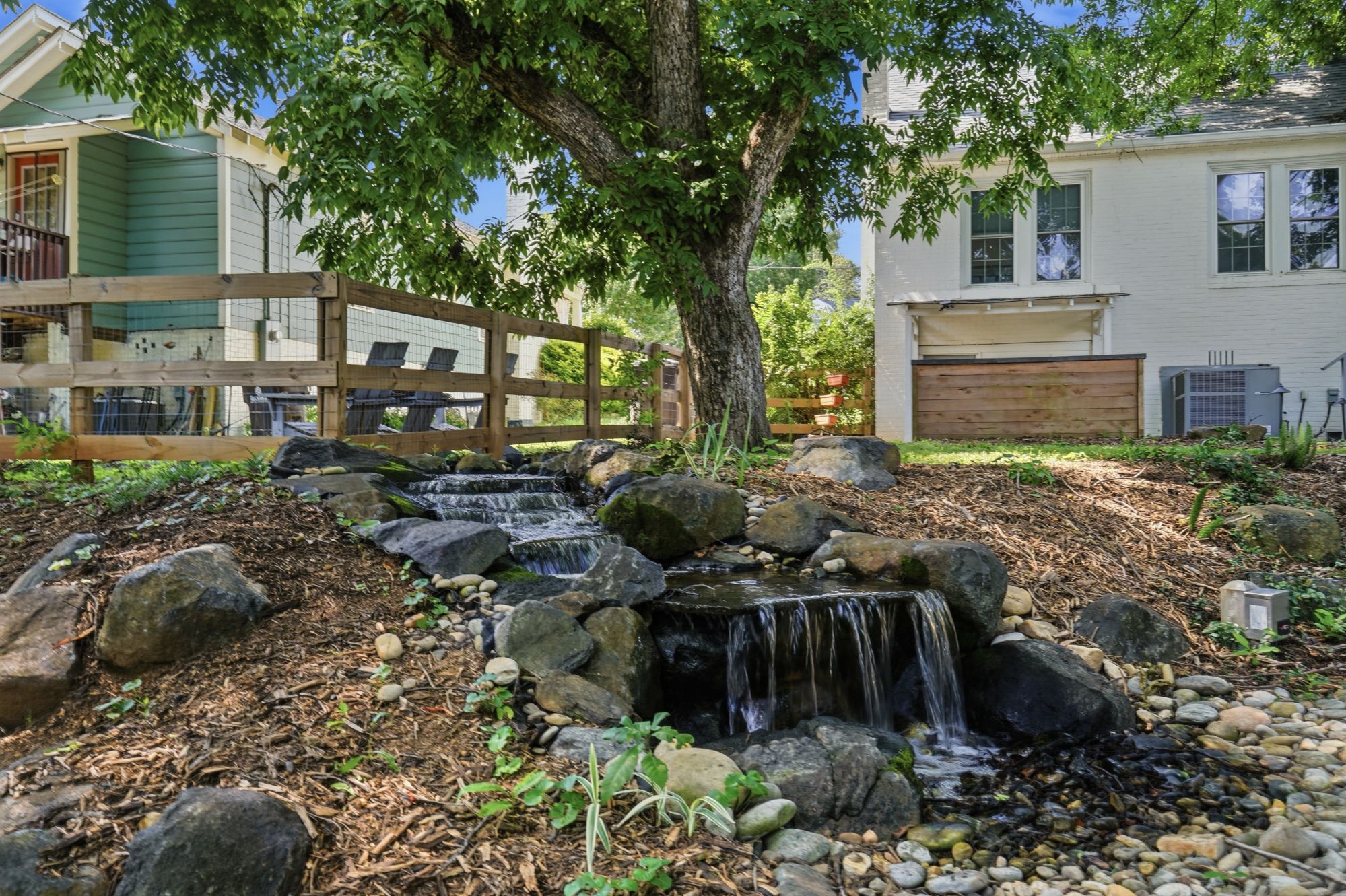 Backyard with a waterfall feature.