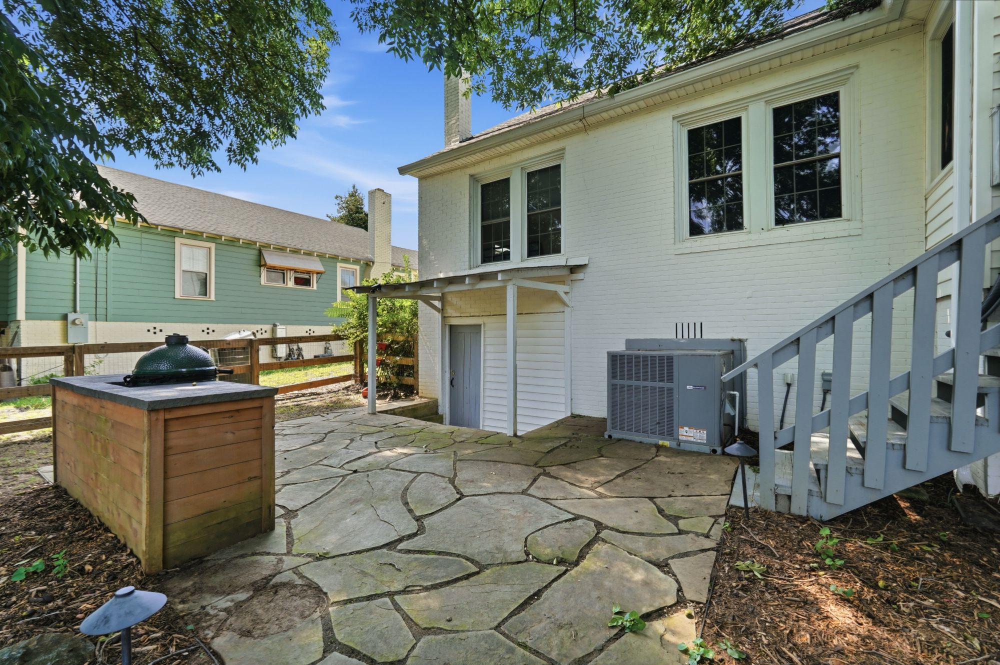 Outdoor kitchen with built in Big Green Egg grill.