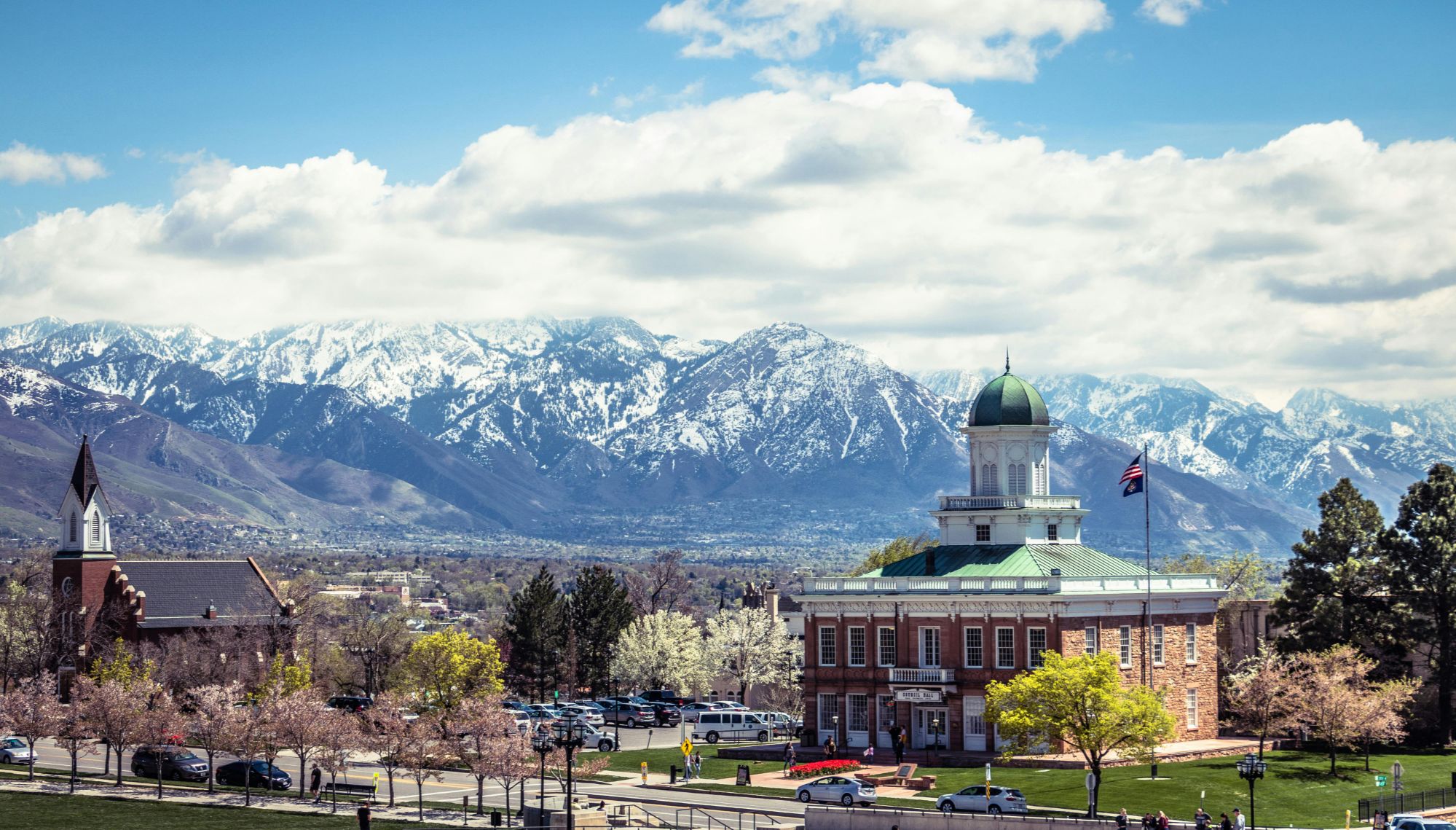 Capitol Hill and LDS temple with snow-capped Wasatch Mountains backdrop in Salt Lake City, Utah