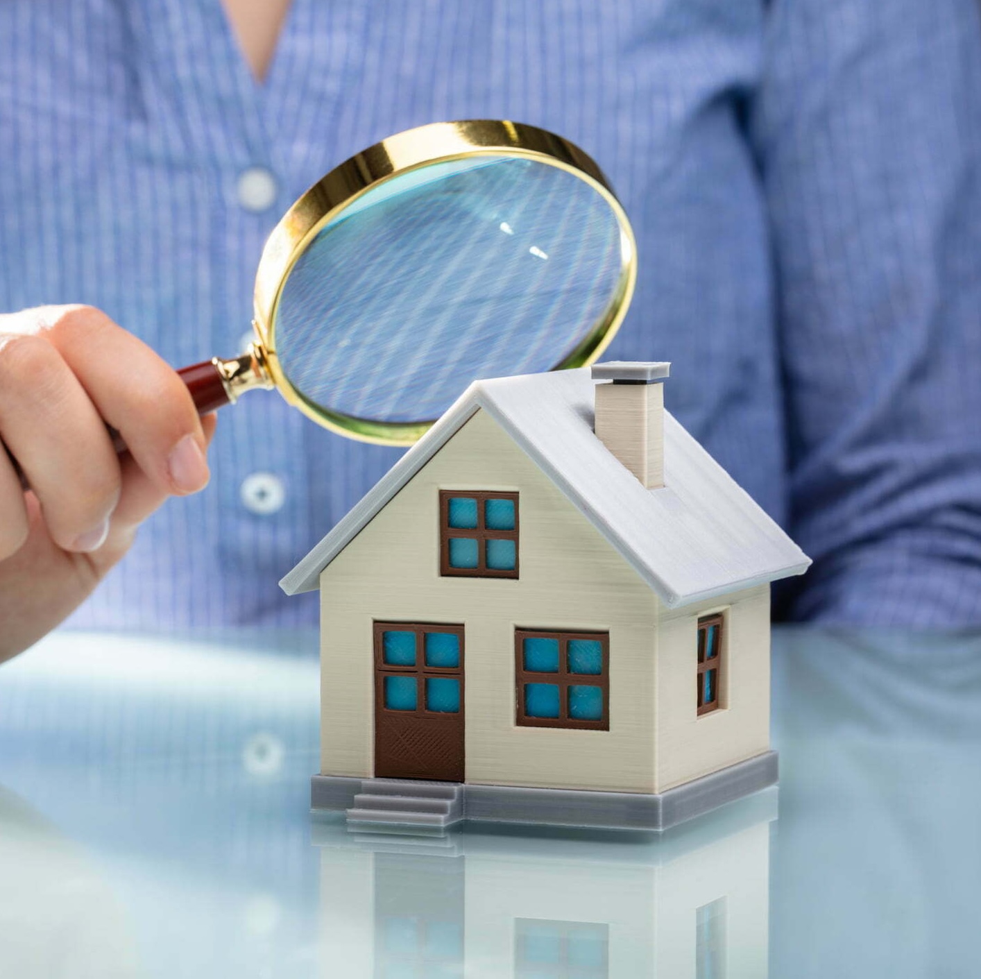 A professional conducting a home inspection during the buying process