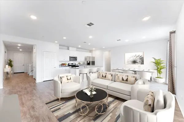 Home with an open-concept living space and natural light from sliding glass doors.