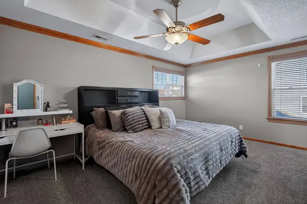 A large bedroom with natural light
