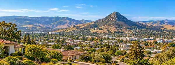 Panoramic Valley Town and Rocky Peak