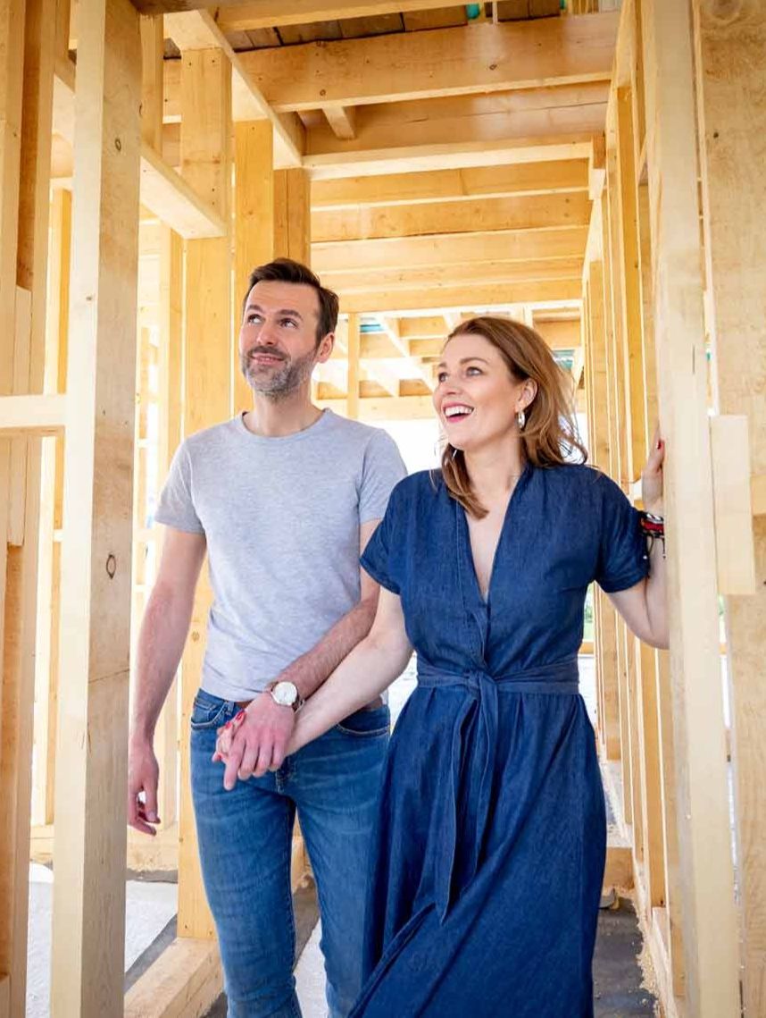 Couple walking through a new home under construction