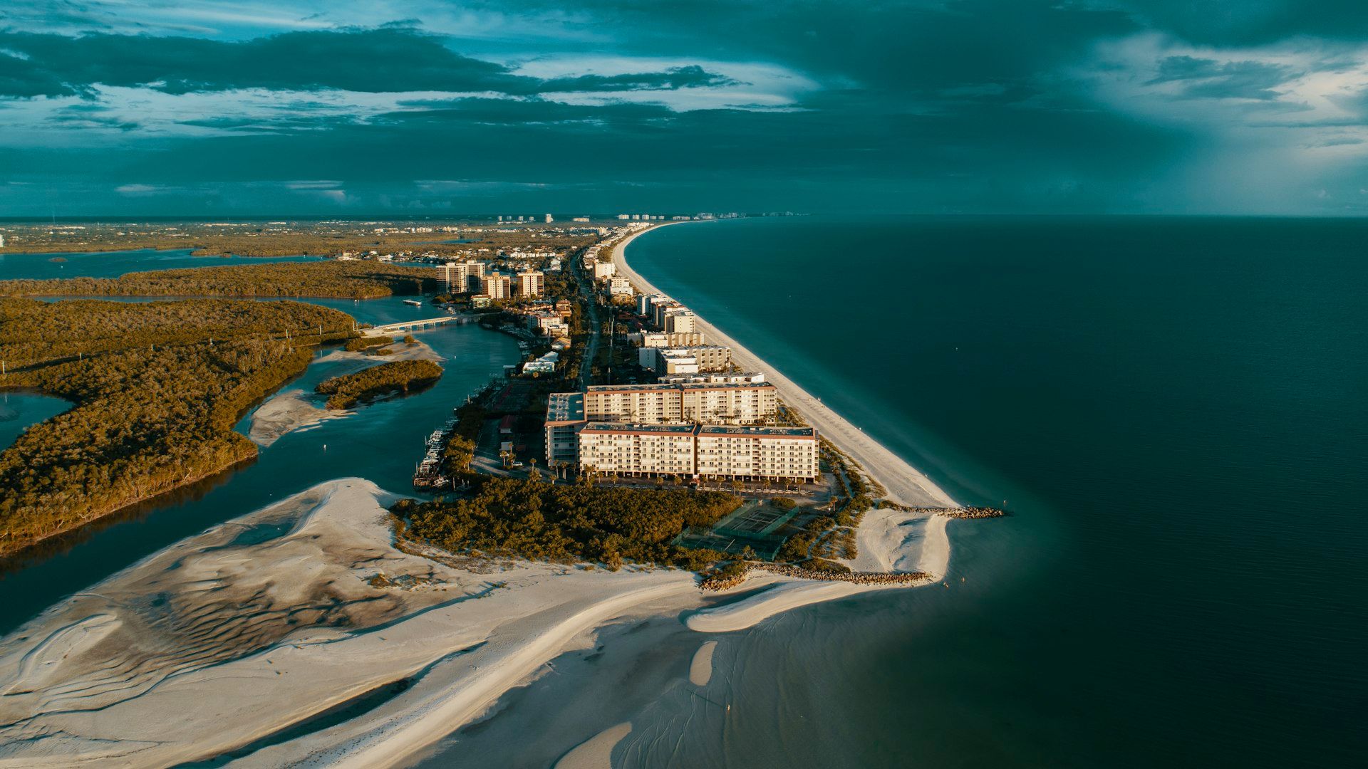 Aerial view of waterfront condominiums on Bonita Beach in Bonita Springs, Florida