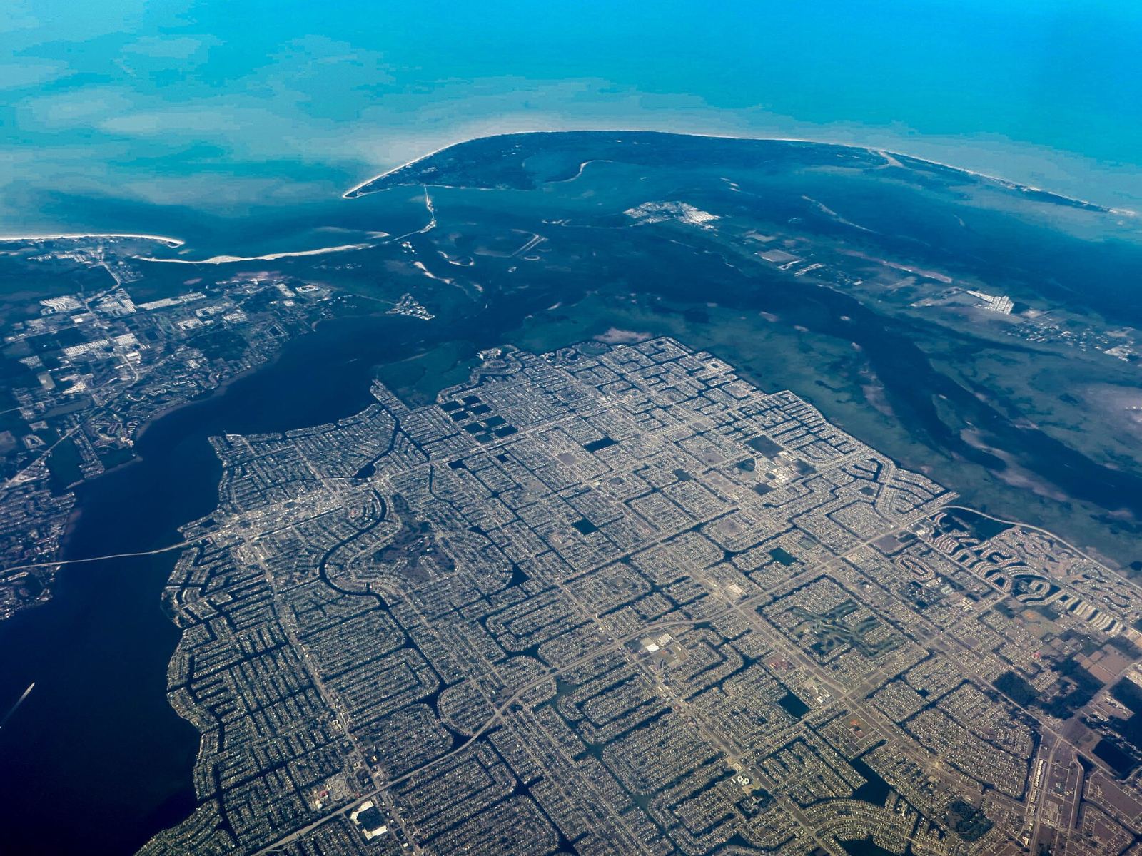 Aerial view of Cape Coral, Florida's canal network leading to the Caloosahatchee River and the Gulf