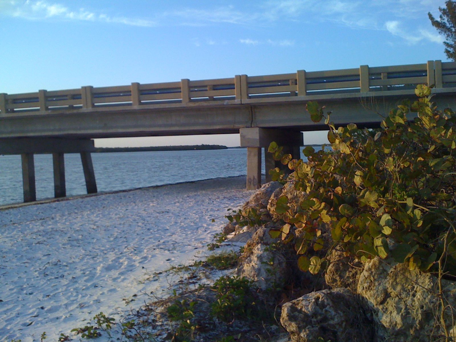 Bridge and beach along the shoreline in Bonita Springs, Florida