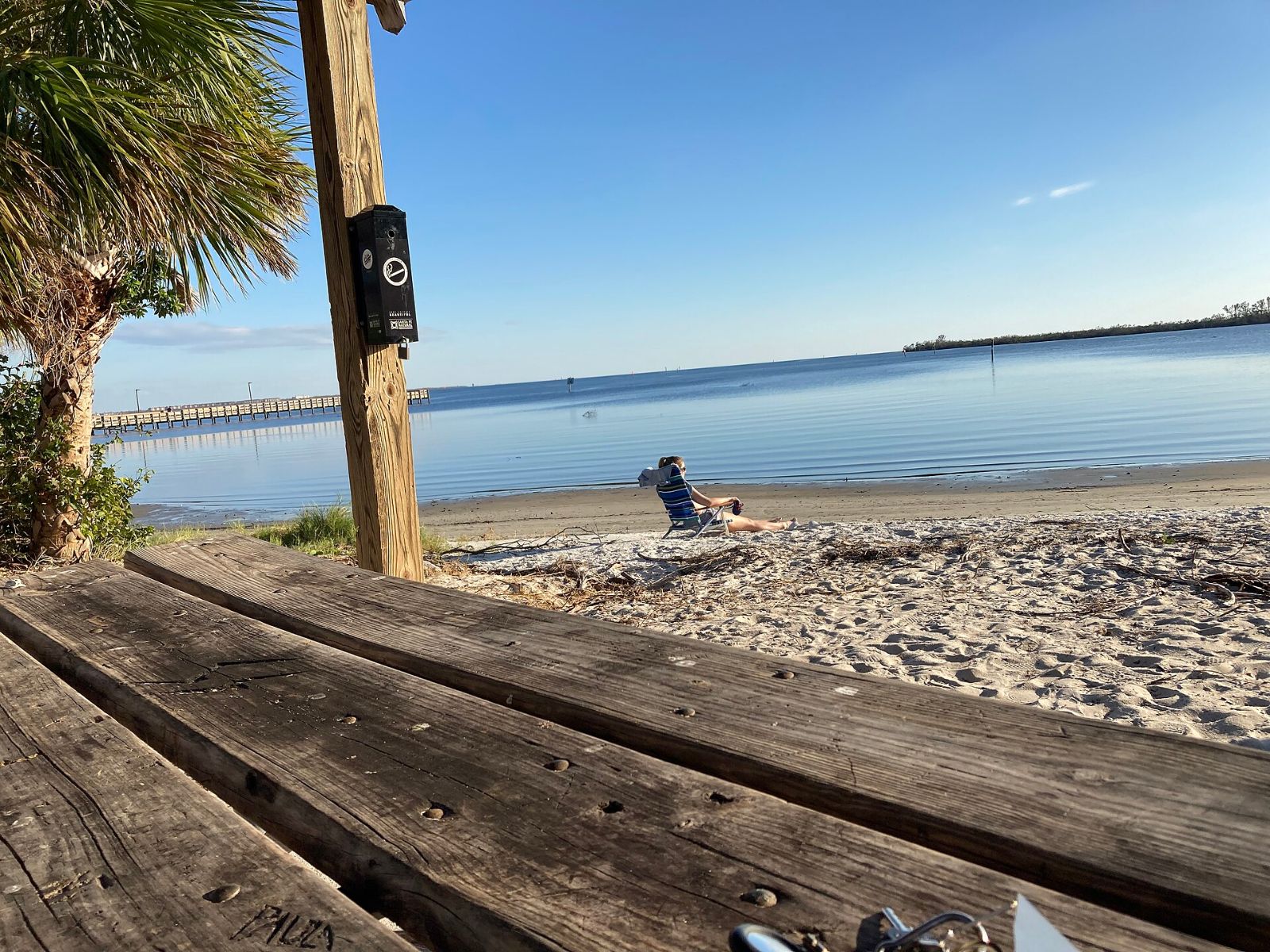 Wooden picnic table overlooking the water at Port Charlotte Beach Park