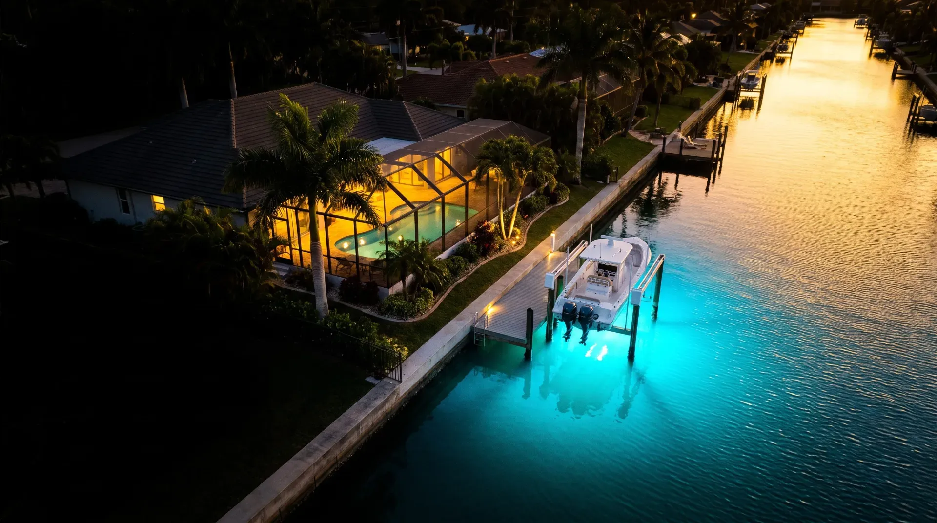 Cape Coral waterfront home with seawall, private dock and boat lift on a Gulf-access canal at sunset (AI-generated illustration)