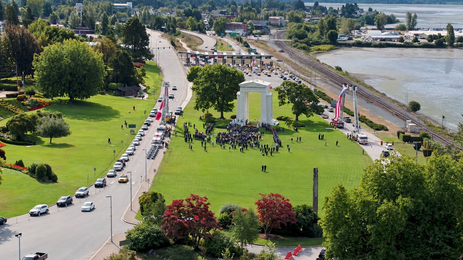 Aerial of the Peace Arch and the I-5 border crossing lanes in Blaine, with Drayton Harbor beyond.
