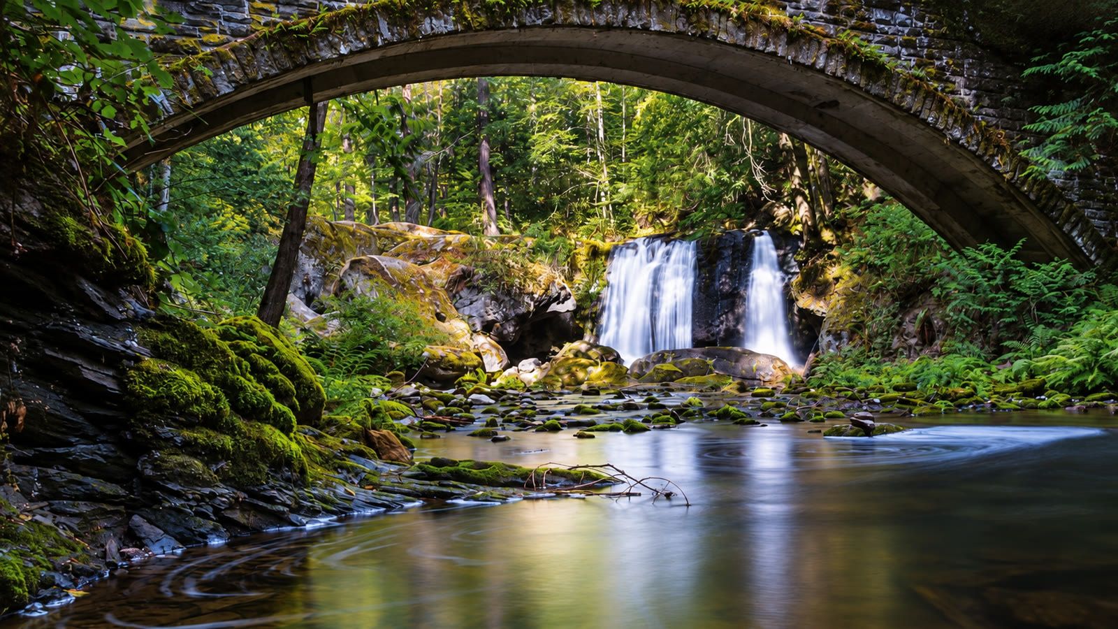 Whatcom Falls seen beneath the old stone bridge in Whatcom Falls Park, Bellingham.