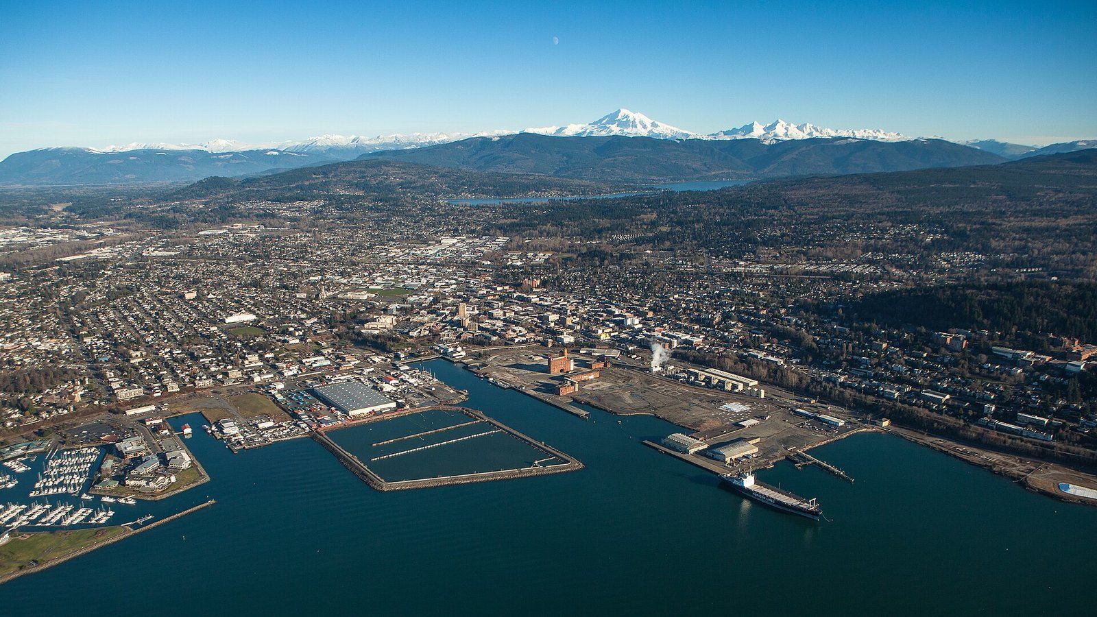 Aerial view of Bellingham's waterfront, downtown and neighborhoods stretching toward Mount Baker.