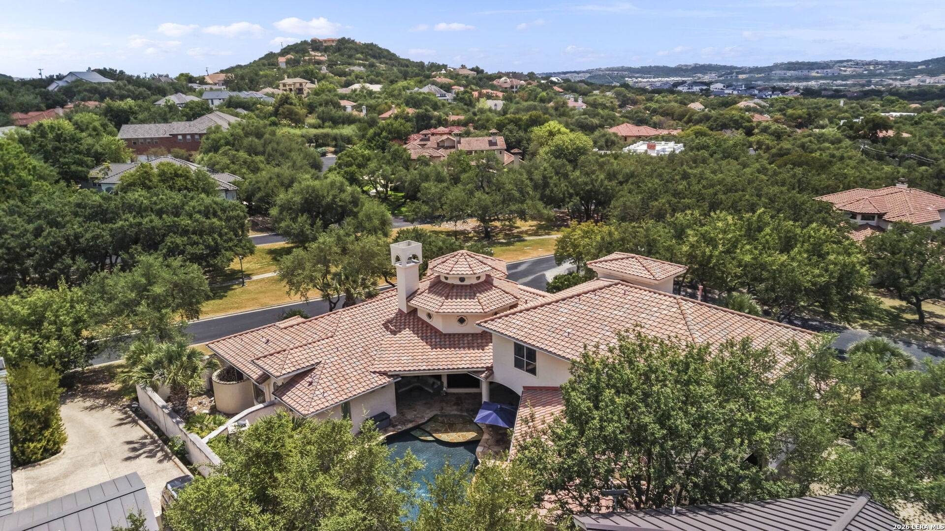 Aerial view of 2 Belcourt Place and the wooded hills of The Dominion, San Antonio