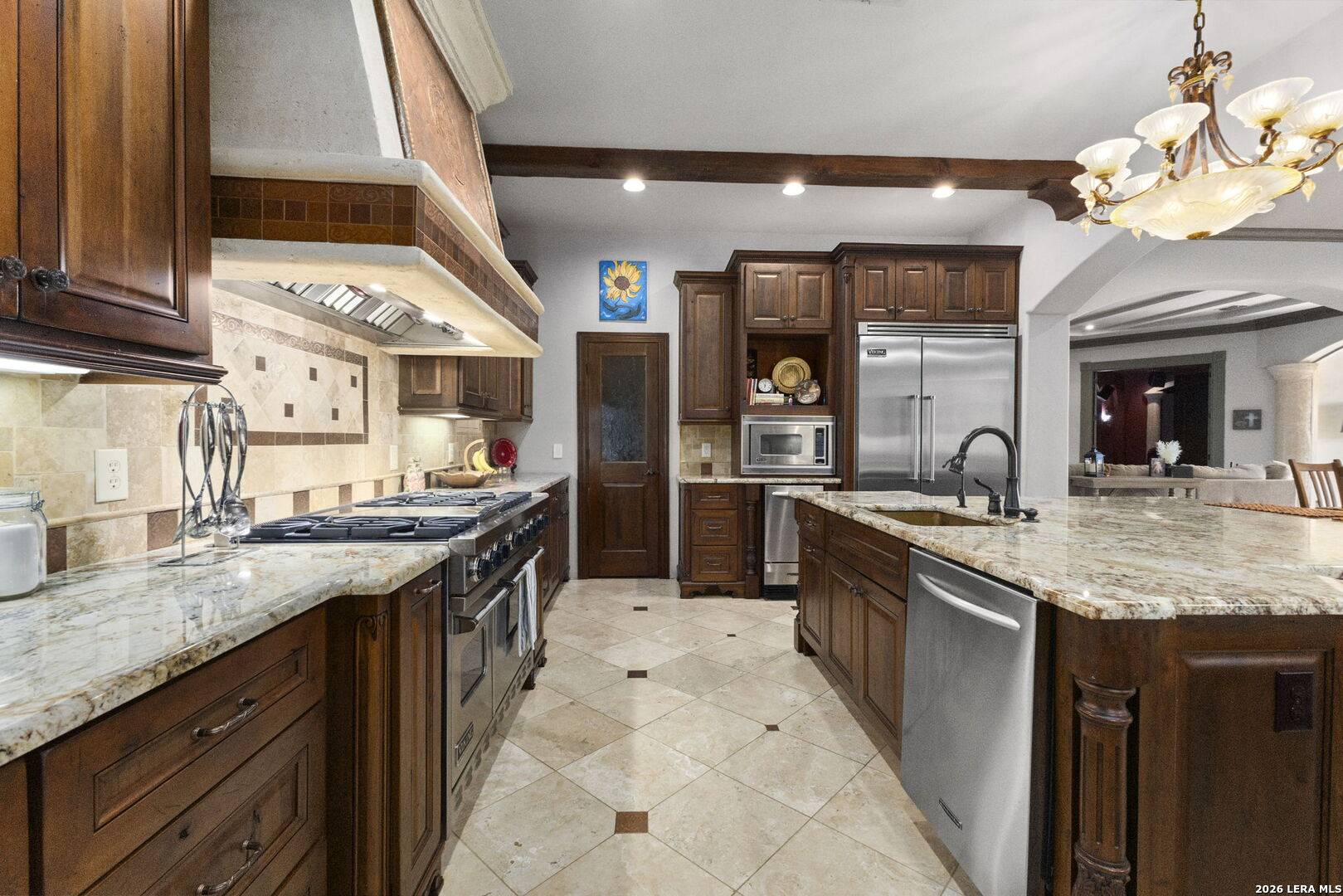 Kitchen of 2 Belcourt Place with custom Michael Edwards cabinetry, granite island and Viking appliances