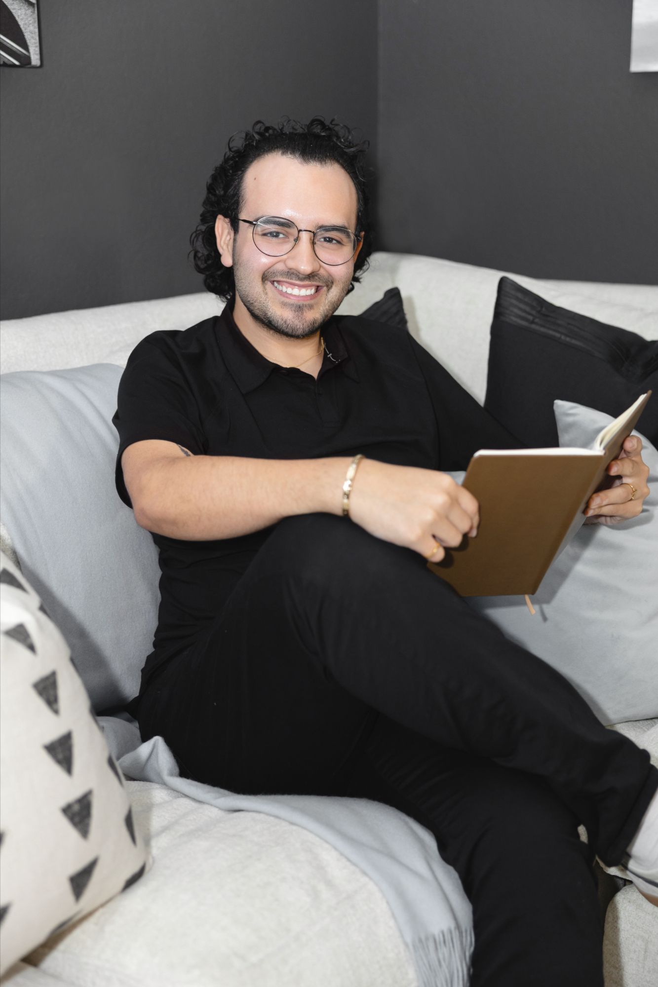 Anthony Sanchez sitting and reading a book