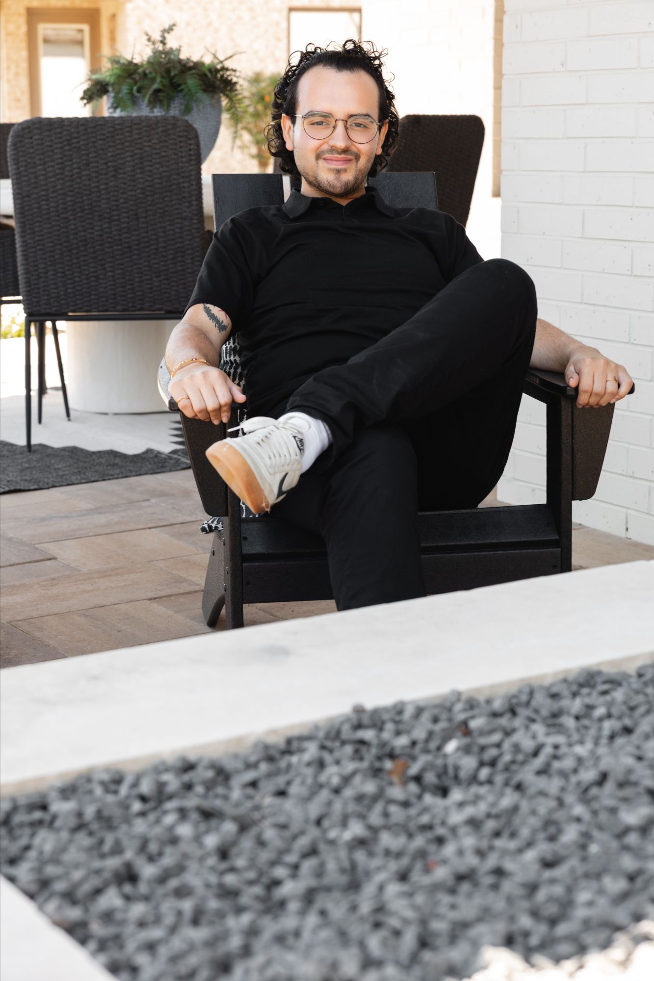 Anthony Sanchez sitting by fire pit