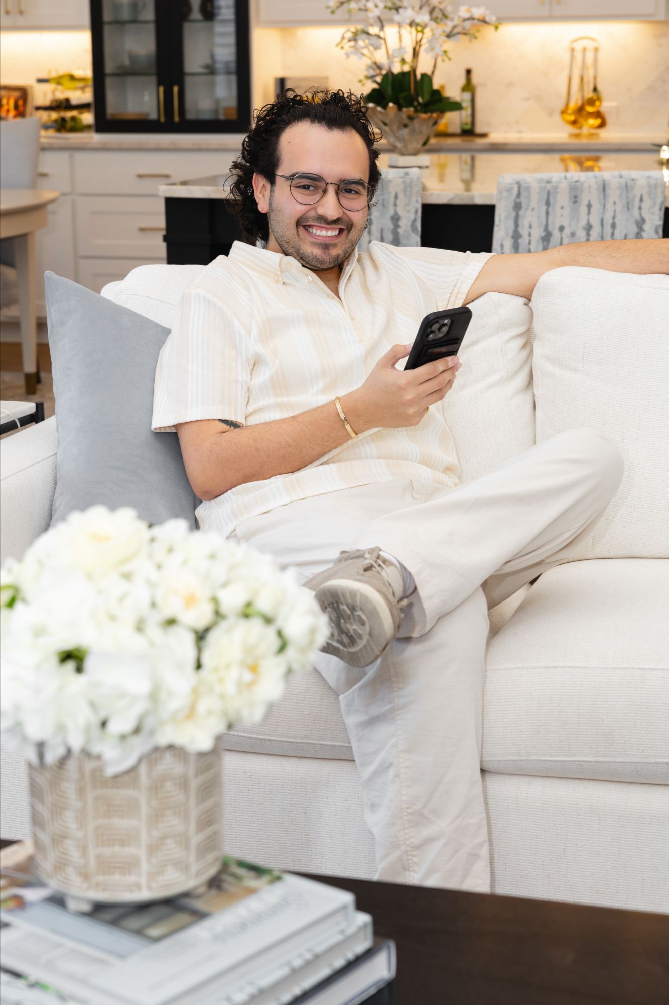 Anthony Sanchez sitting on couch