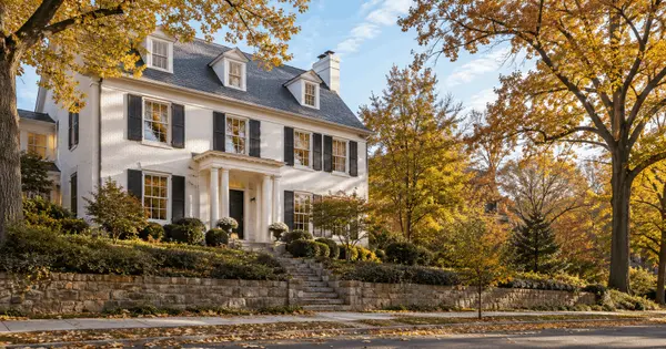White brick Georgian house on a tree-lined street in Northwest Washington DC in fall