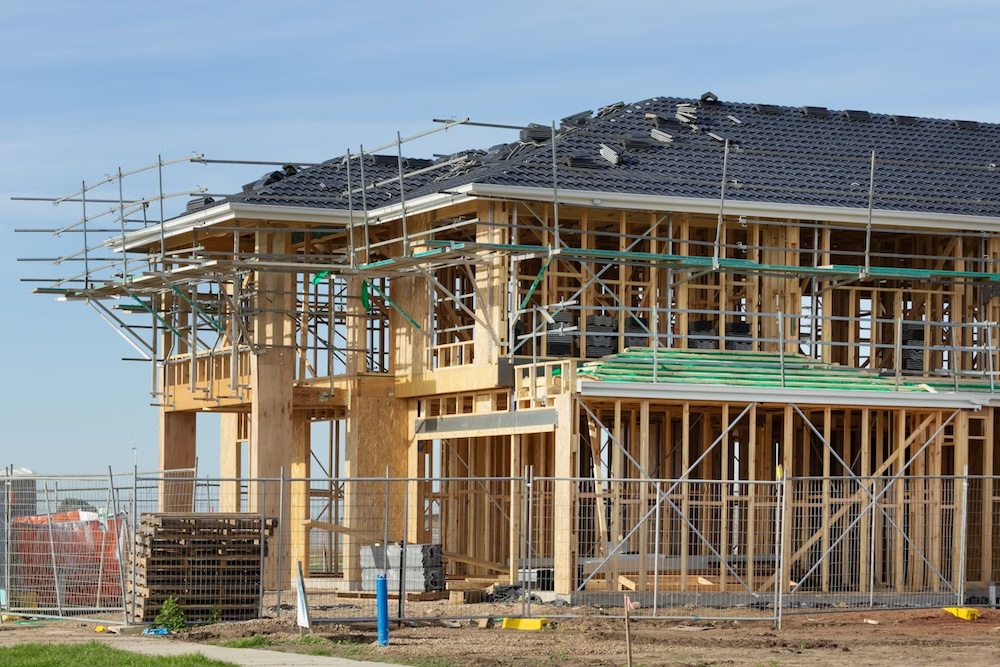 New home construction site in Nevada County with framing and open sky