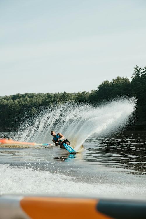 Water skier crossing a Nevada County reservoir on a warm summer evening
