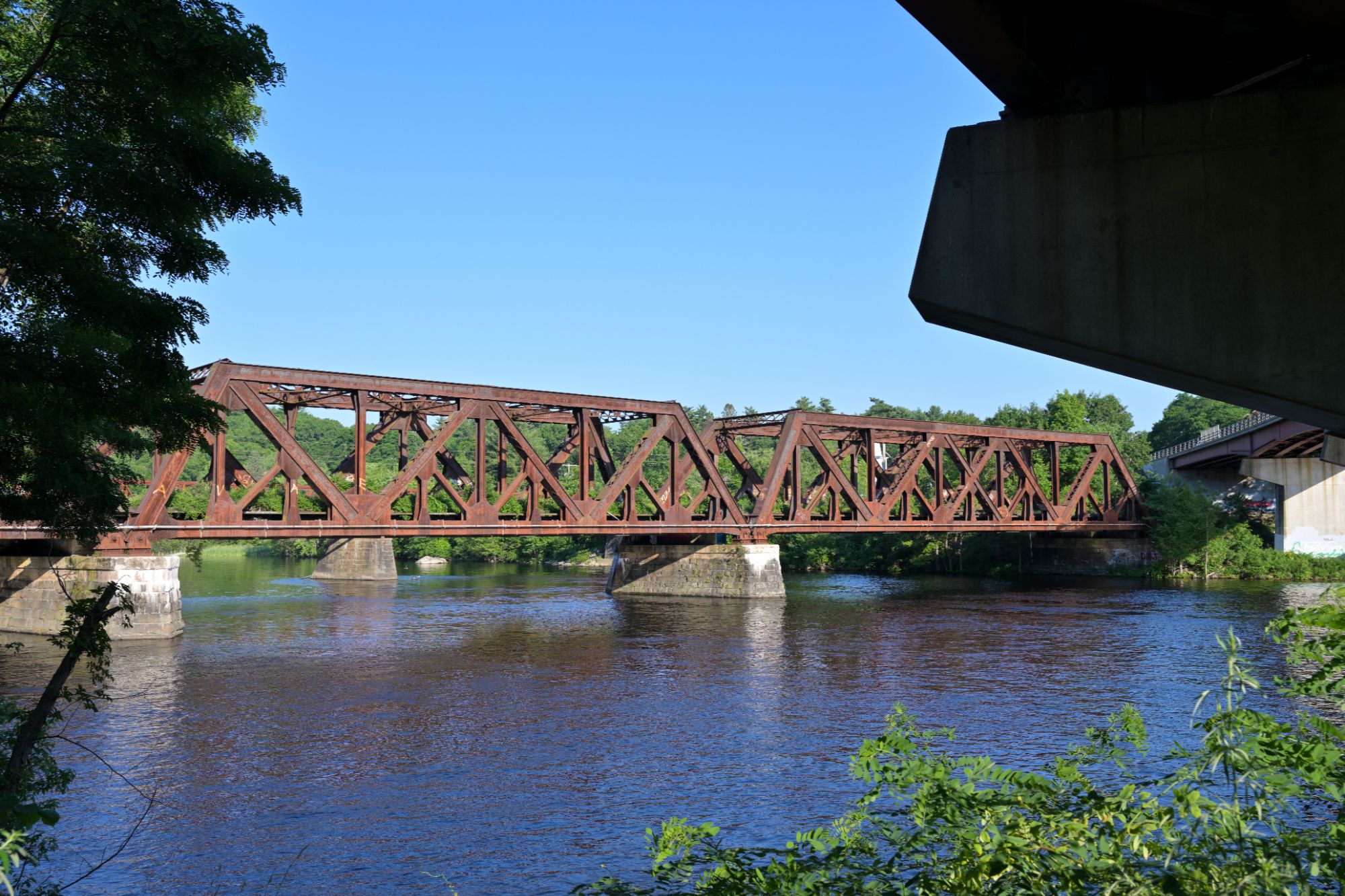 Nashua_Subdivison_railway_bridge_over_Merrimack_River_in_Hooksett,_NH_June_2026