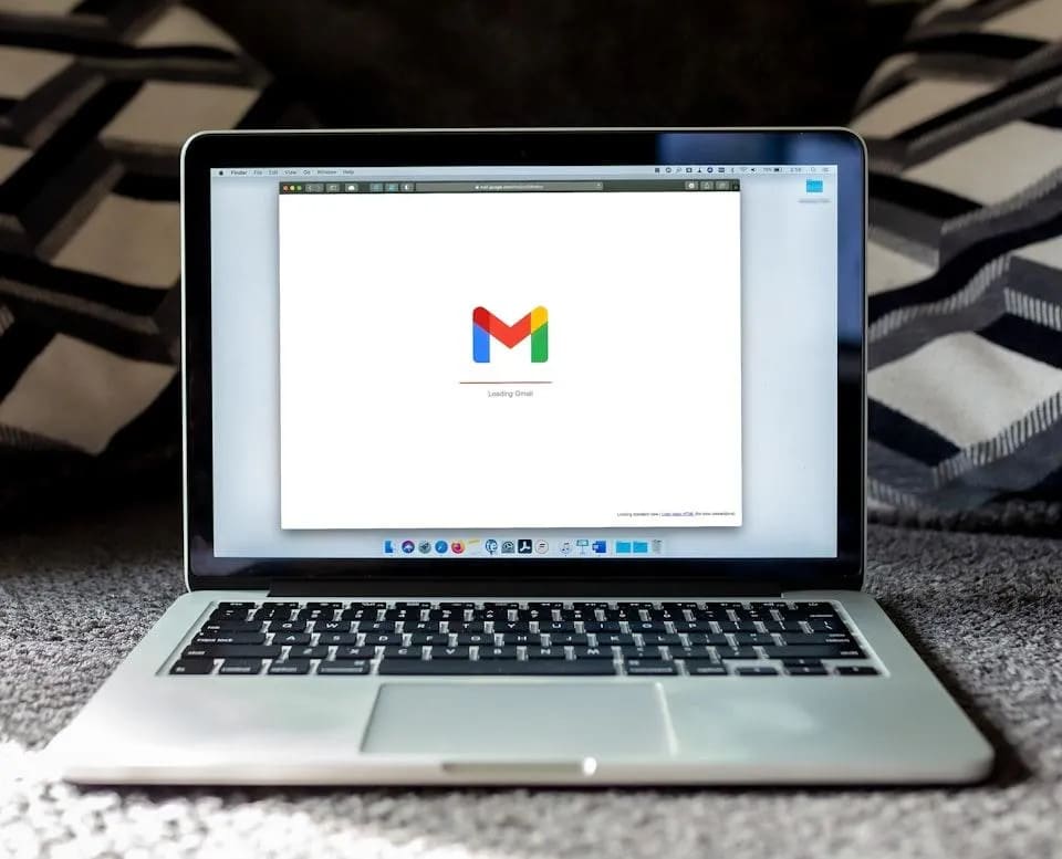 Laptop with Gmail on screen.