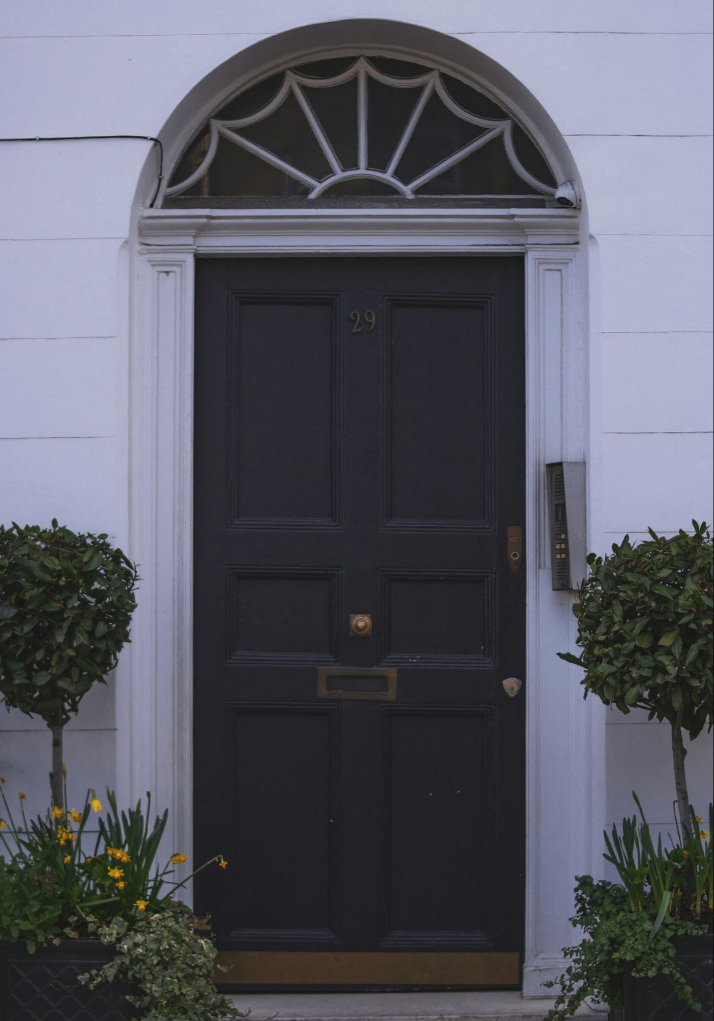 White house with round-top front door