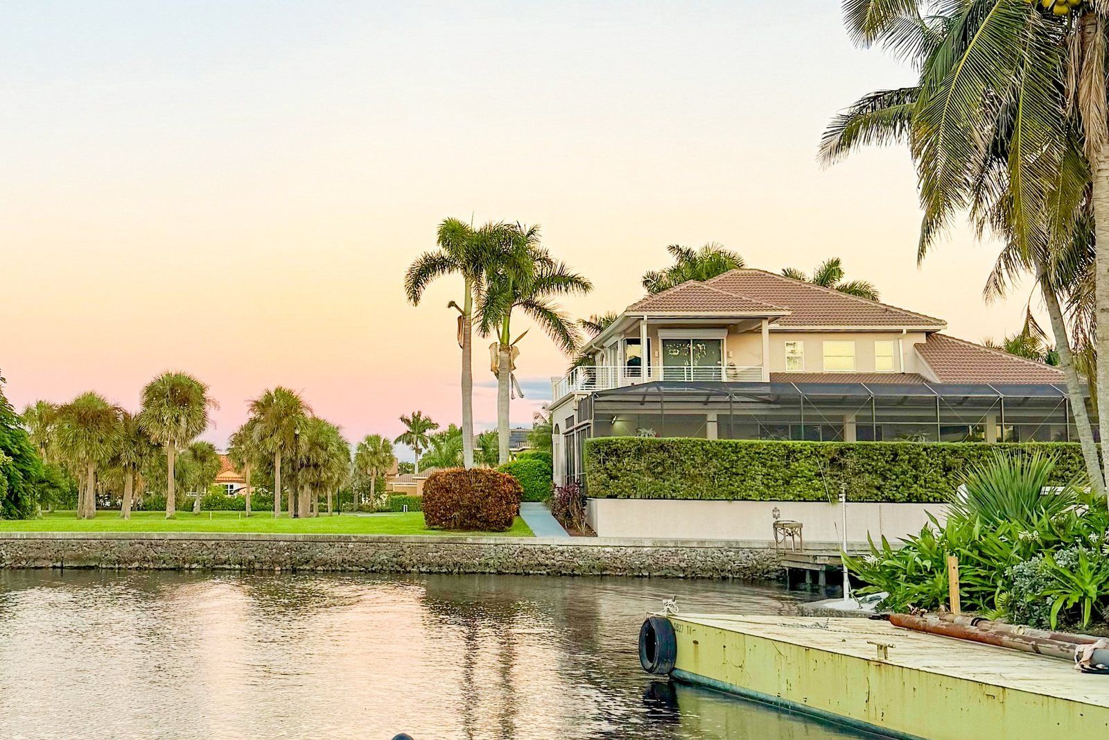 Florida waterfront home on a canal at sunset