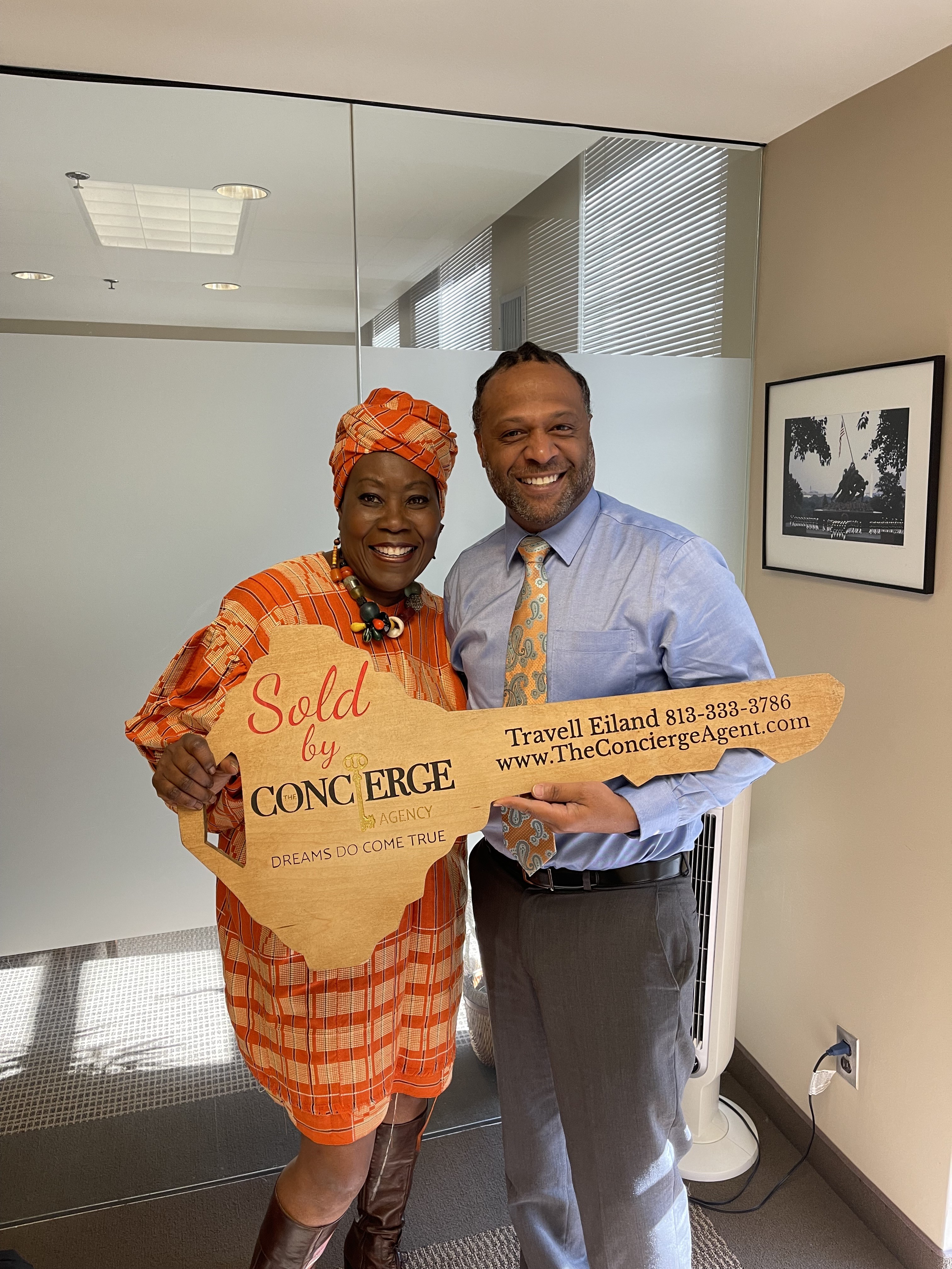 Travell Eiland with clients, key handoff