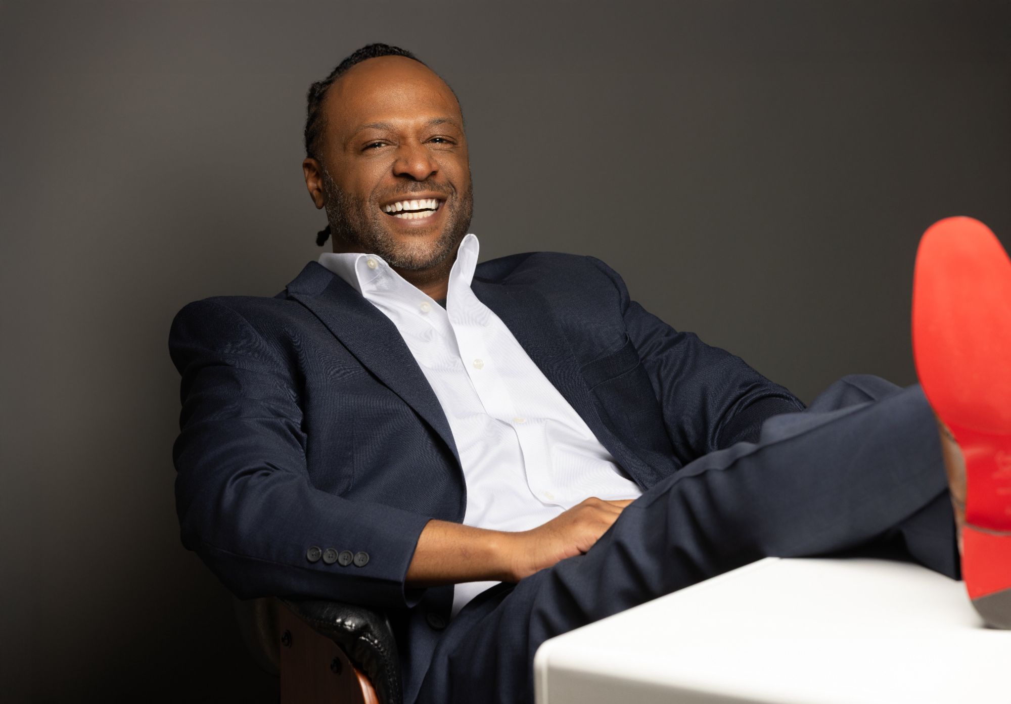 Travell Eiland, feet up on the desk