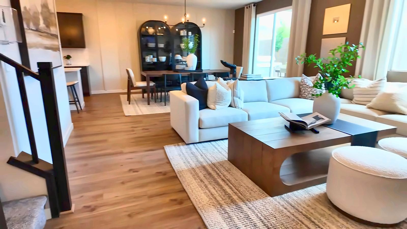 Great room in the Pulte Camelia two-story model at Sora at Aries, open to the dining area