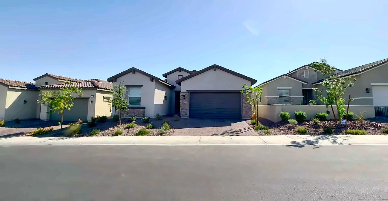 Street of newer single-story homes with desert landscaping in the Cadence community, Henderson