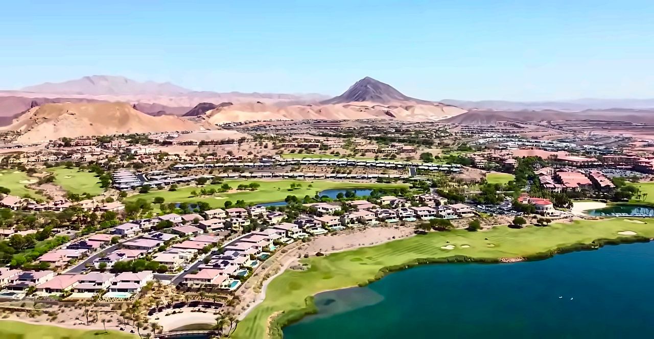 Aerial view of Lake Las Vegas in Henderson with the lake, a golf course, homes and desert mountains