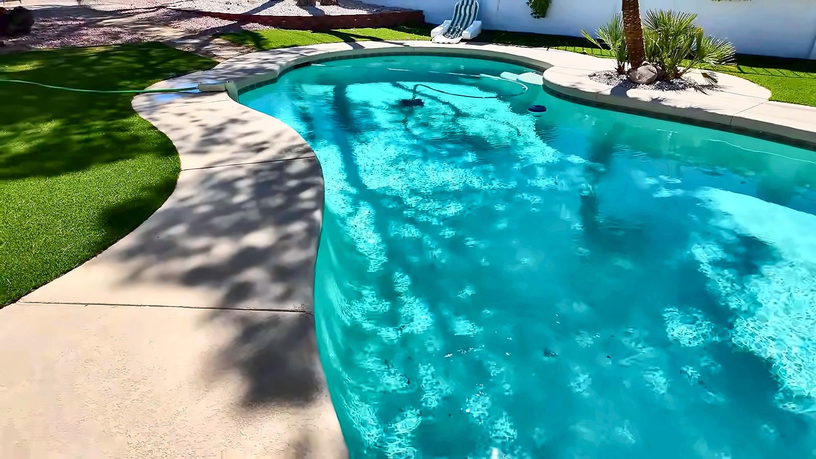 Backyard pool with turf and a concrete deck at a Las Vegas resale home