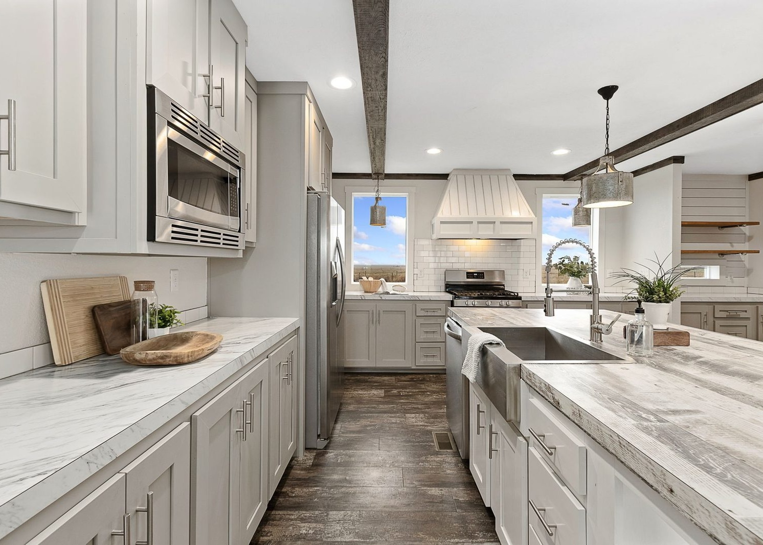 Bright kitchen with white cabinets and a farmhouse sink