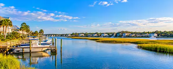Sunlit Coastal Marina and Marsh Inlet