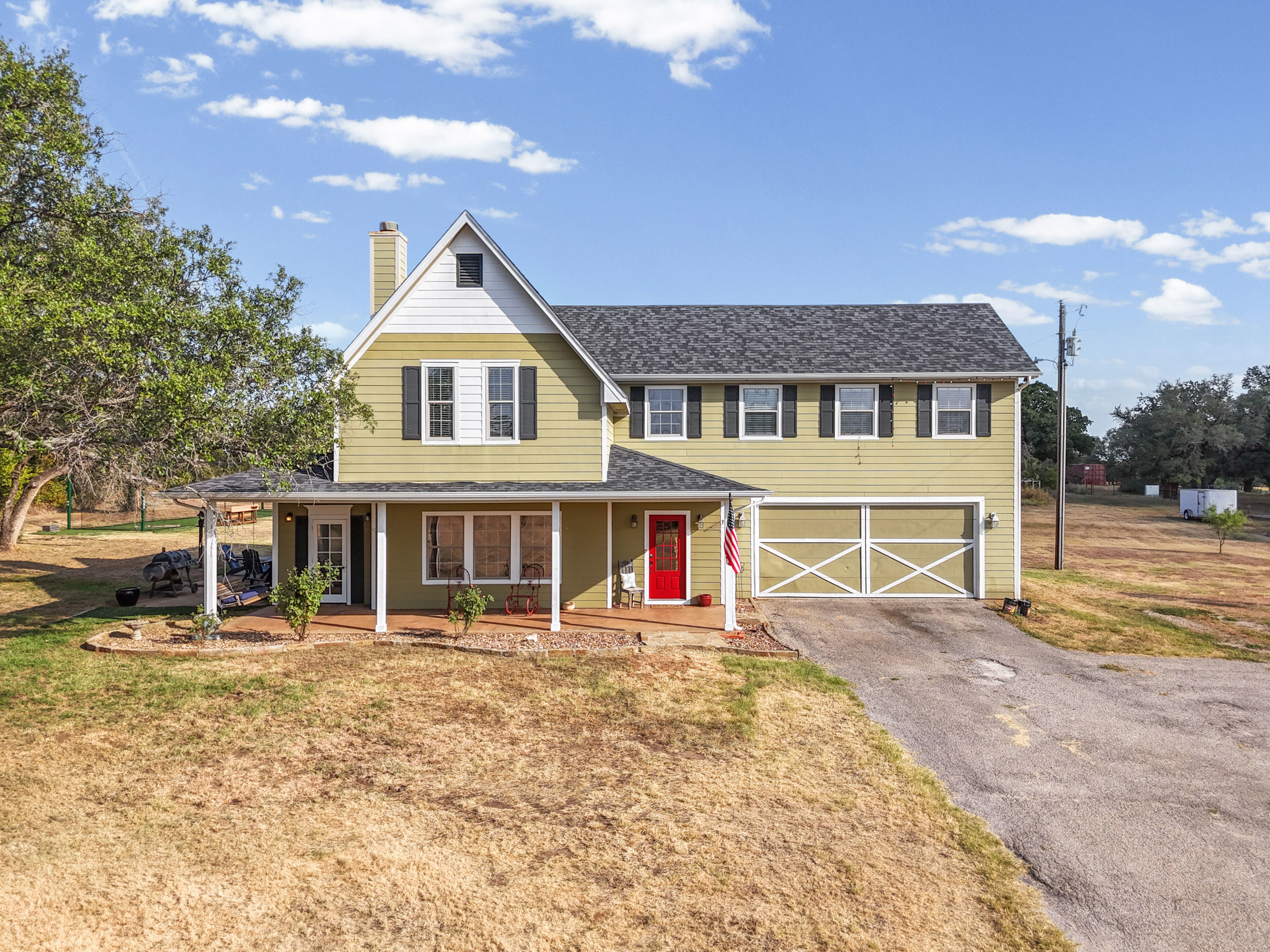 Front exterior of 325 Bolton Road, a gated 5-acre property in Granbury, TX