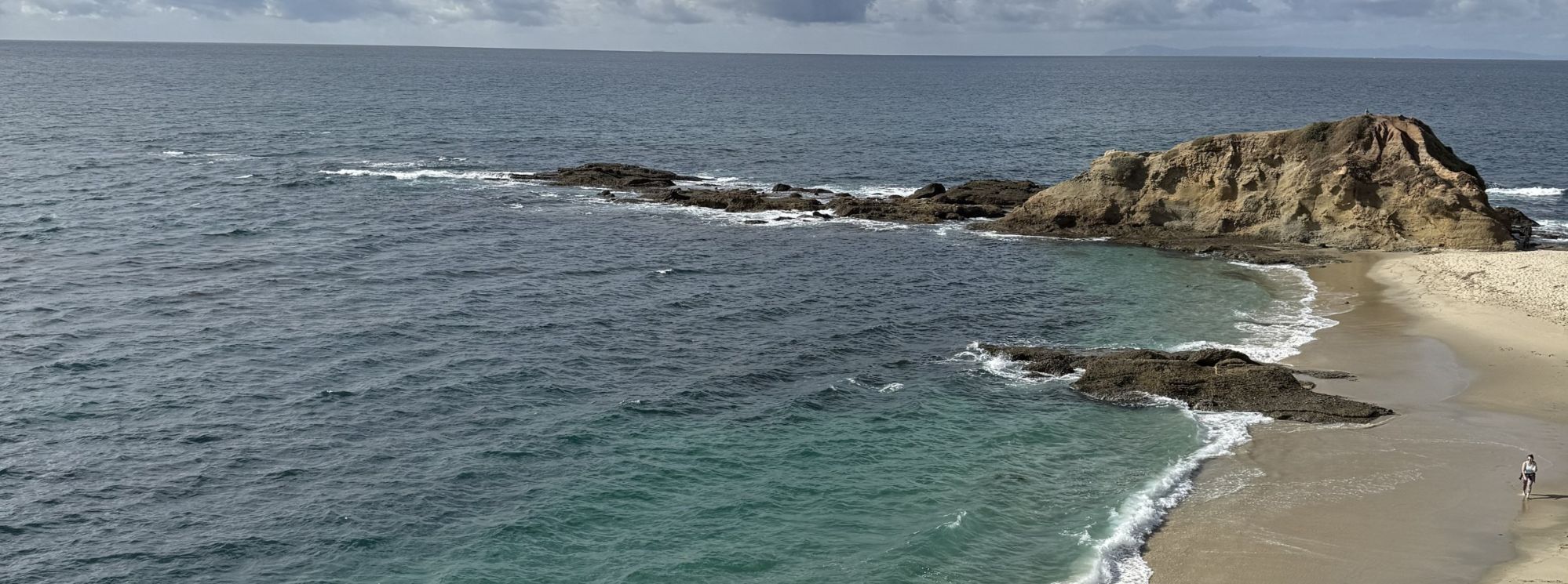 A sandy cove and rock point on the coast by the Montage in Laguna Beach, California