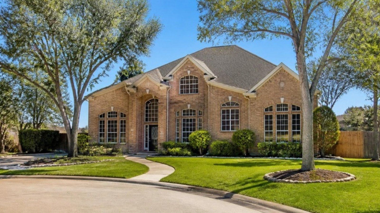 Brick two-story resale home on a cul-de-sac with mature trees in the Katy, TX area