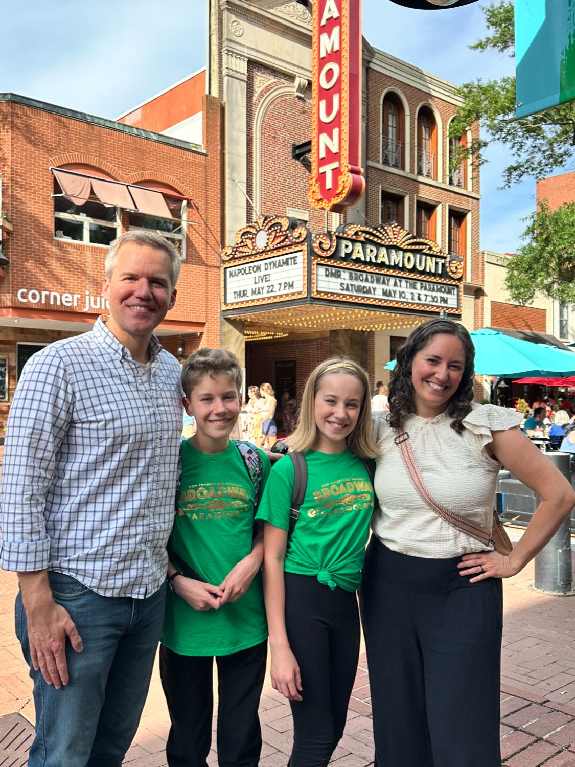 Dory and family standing on Downtown Mall in Charlotteville in front of the Paramount Theater and Corner Juice