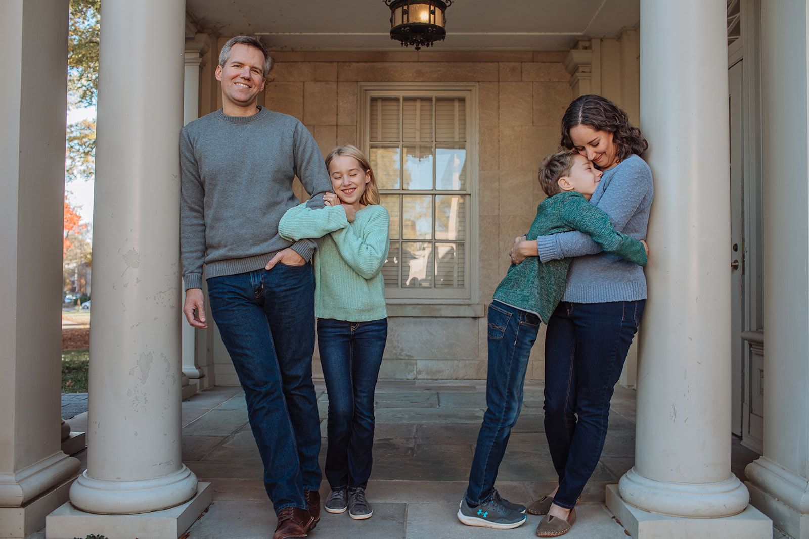 Dory Tucker Doyle, Charlottesville real estate agent, standing with her family 
