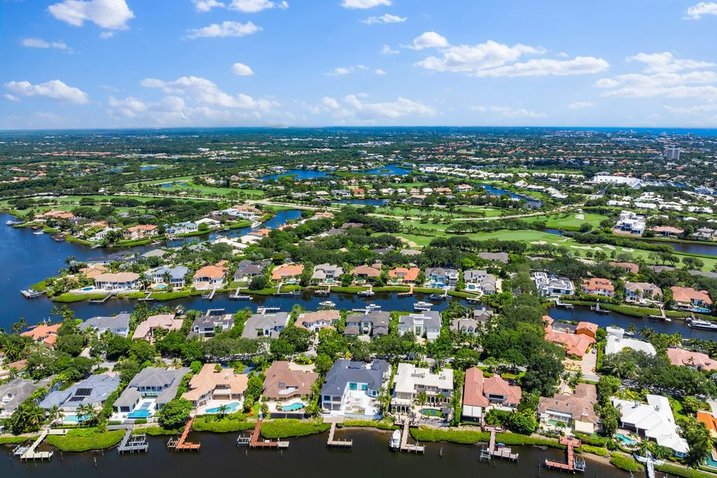 Aerial view of Admirals Cove marina, golf course and waterways in Jupiter Florida