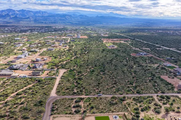 Aerial drone view of Arizona desert land with mountain views
