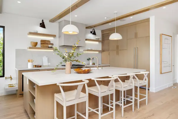 bright-modern-kitchen-with-island-and-wood-accents-2026-03-18-09-56-31-utc