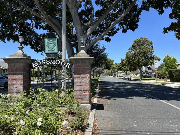 Rossmoor CA luxury homes - sunny aerial view of tree-lined Orange County neighborhood and park