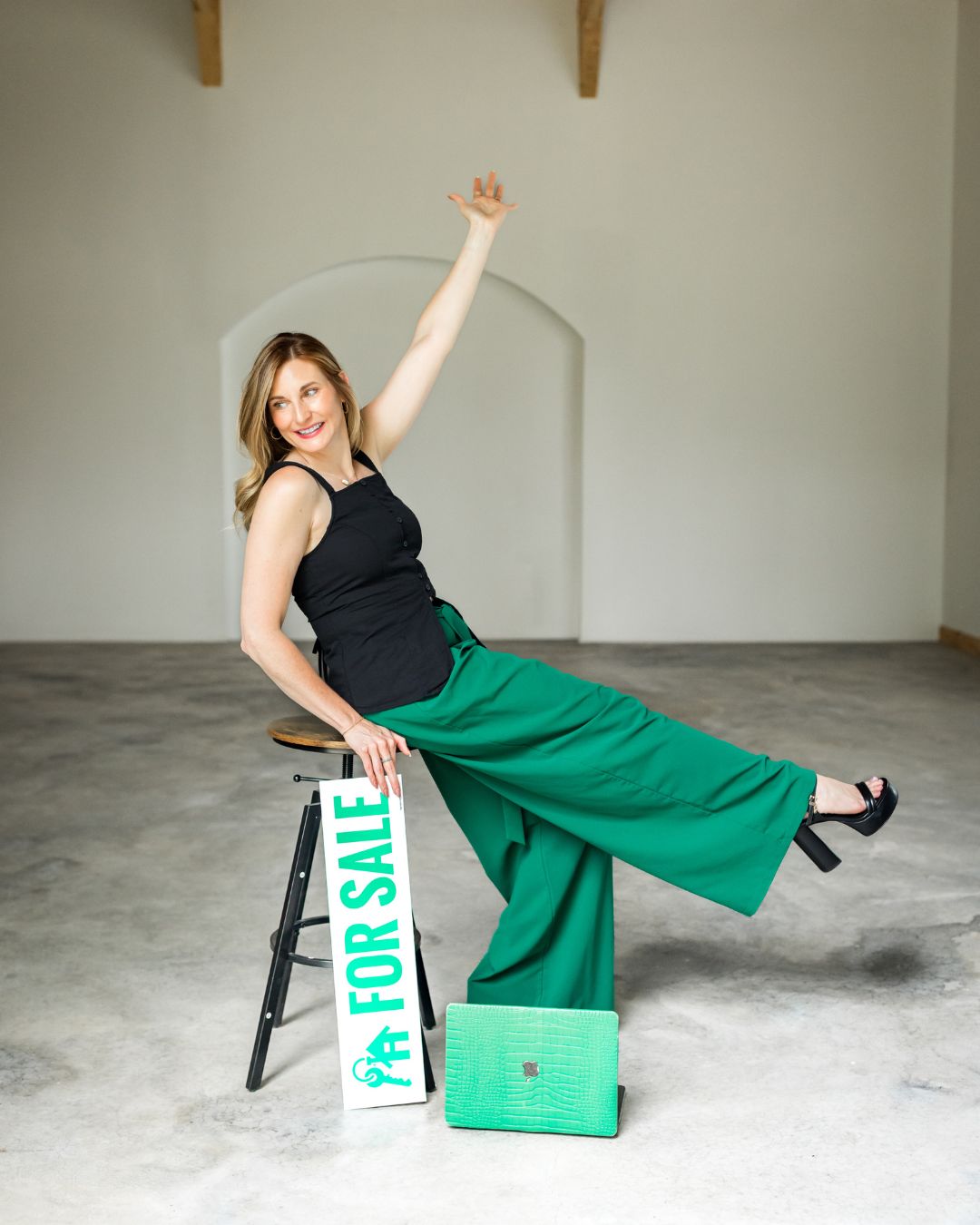 Jennifer Moran with a For Sale sign