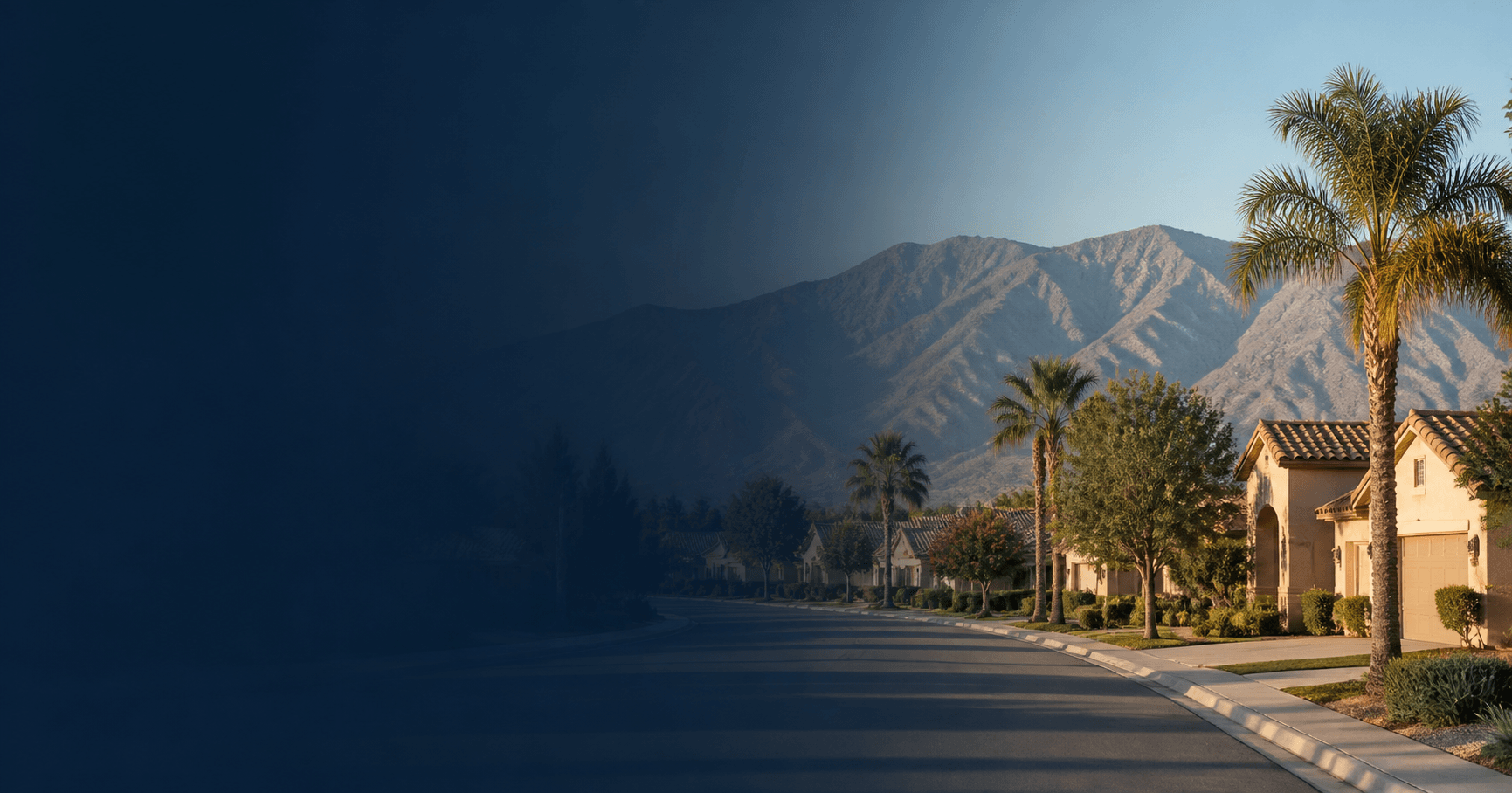 Inland Empire suburban neighborhood street with palm trees and mountains